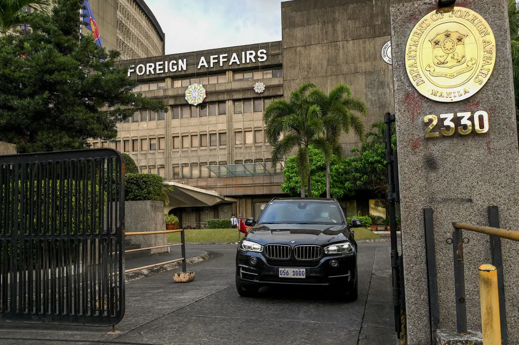 A Chinese diplomatic vehicle leaves the Department of Foreign Affairs in Manila.