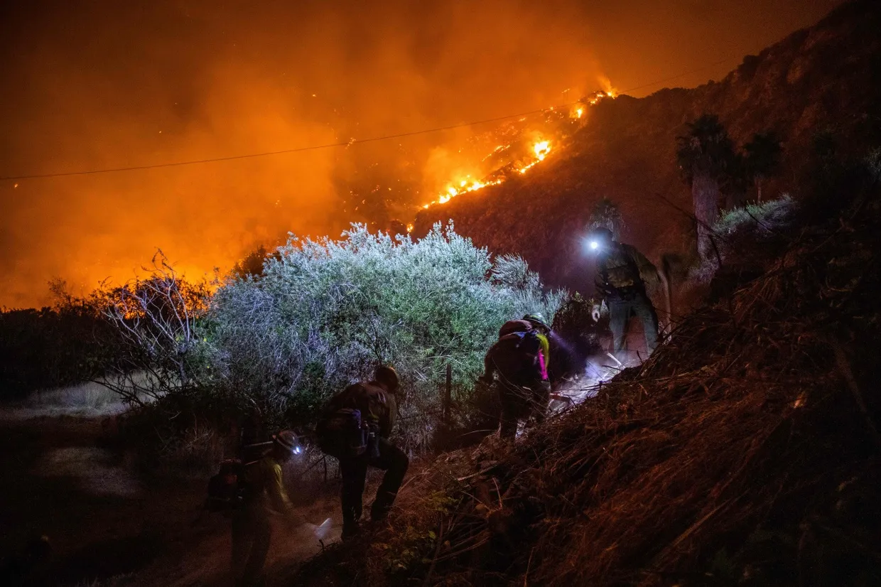 Firefighters battle&nbsp;smoke and flames from the Ranch Fire in Azusa, California, on Aug. 14.&nbsp;