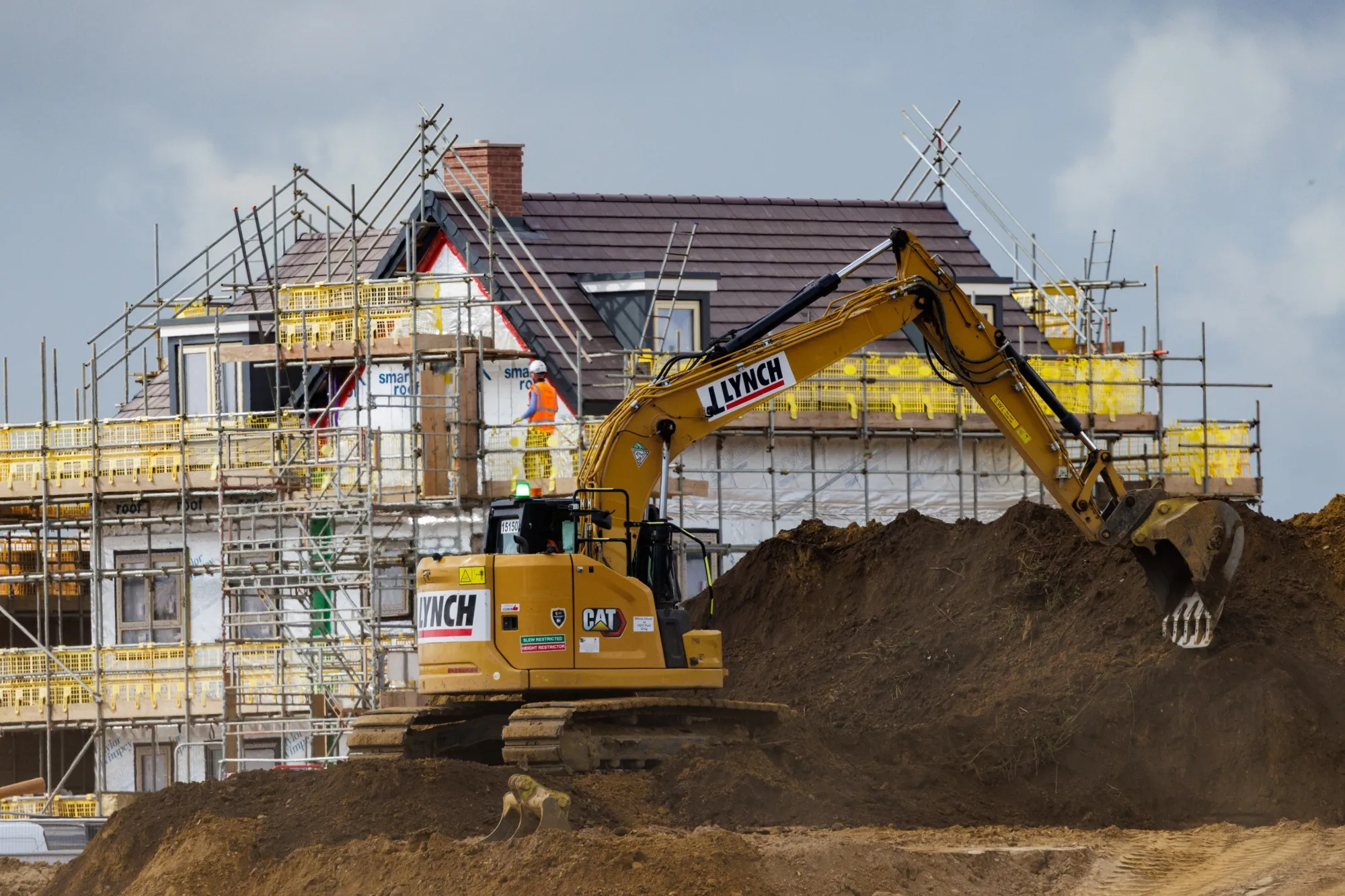 Building works at a residential construction site in Ockham, UK.
