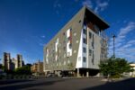 The St. Francis Apartments in Denver opened in 2018 after St. John's Cathedral leased a parking lot it owned to a nonprofit developer. The 50-unit building houses formerly homeless people in the city's Capitol Hill neighborhood.