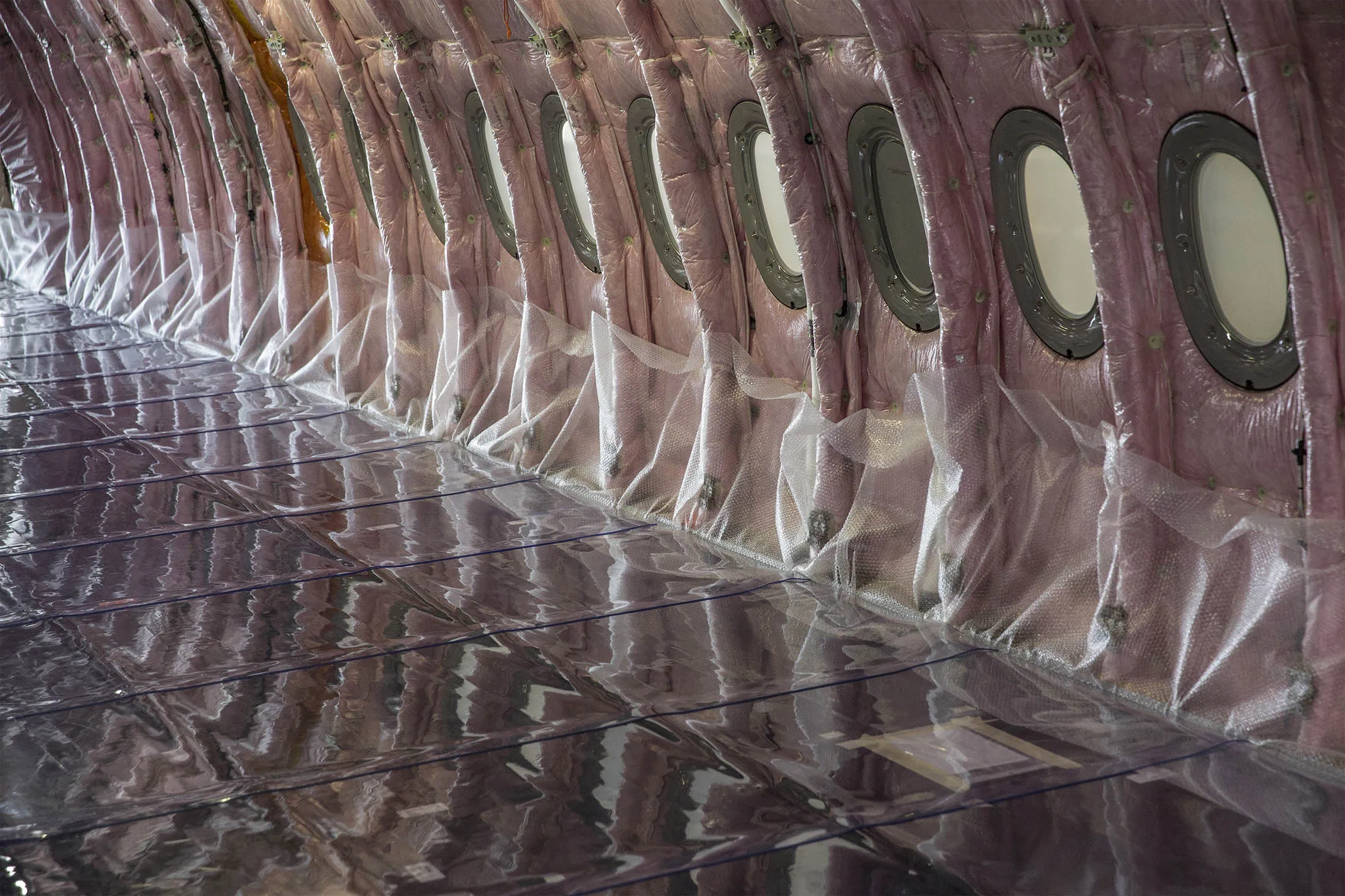 Protective bubble wrap sits in the fuselage interior of an Airbus A350 XWB passenger aircraft.
