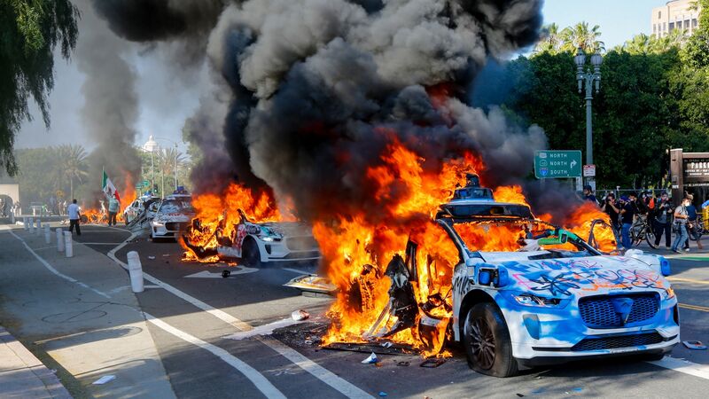A row of Waymo vehicles burn during an anti-ICE protest in Los Angeles, on June 8.