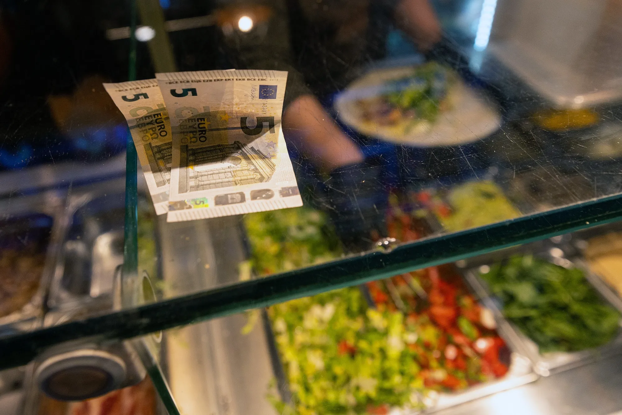 Euro banknotes&nbsp;on the counter of a street food vendor in Berlin, Germany.&nbsp;