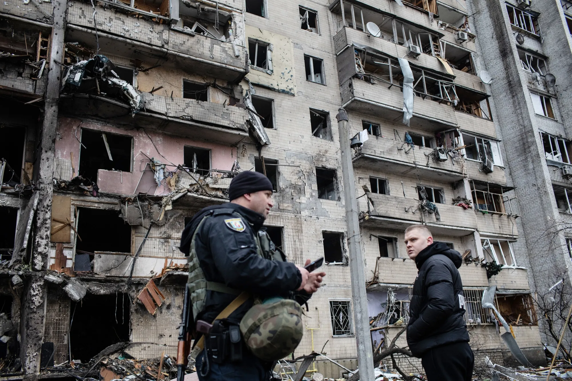 Residents and police inspect a damaged building following a blast&nbsp;in Kyiv, Ukraine, on&nbsp;Feb. 25.