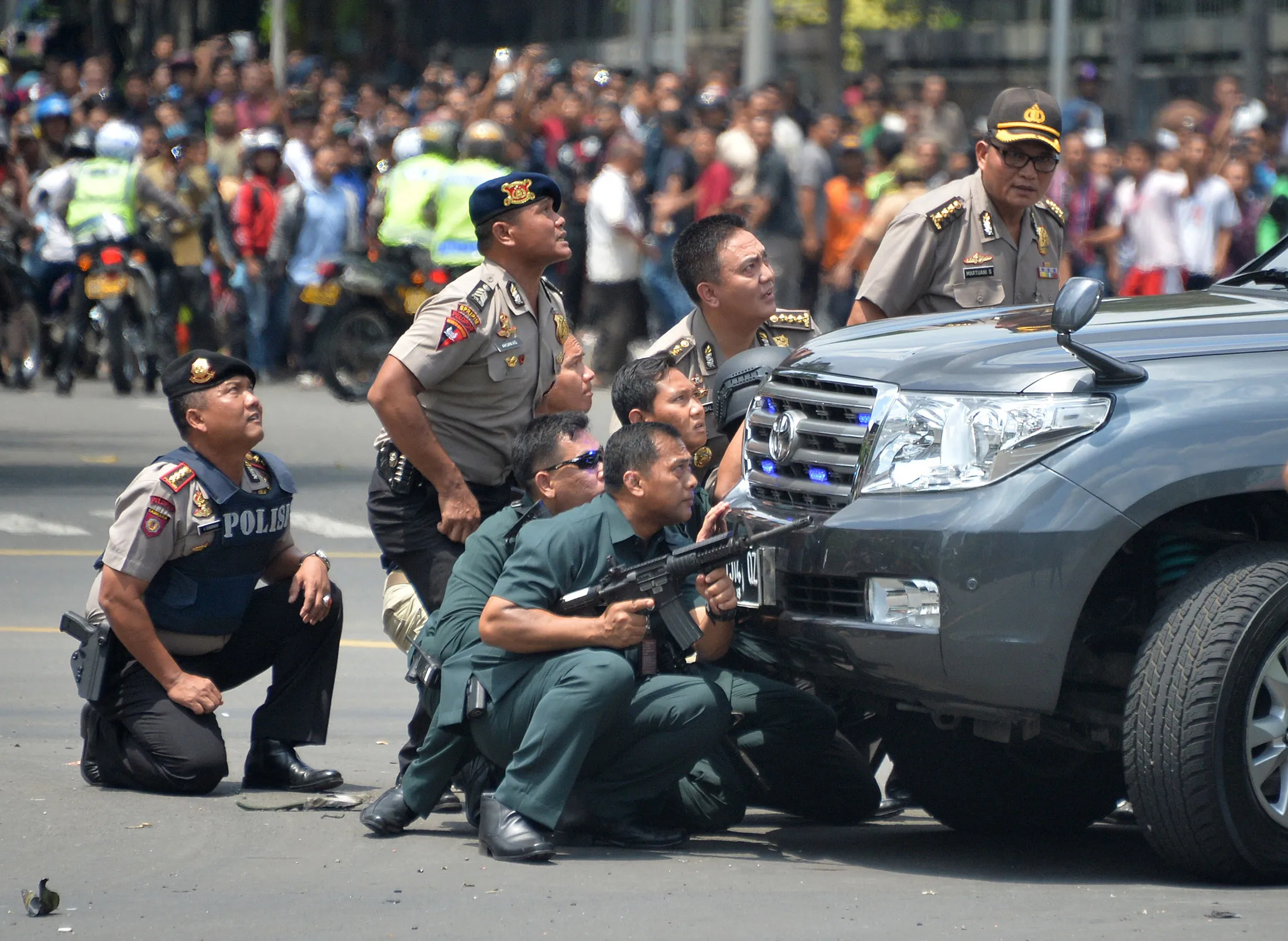 Police take up position after a series of blasts in Jakarta on Jan. 14, 2016.

