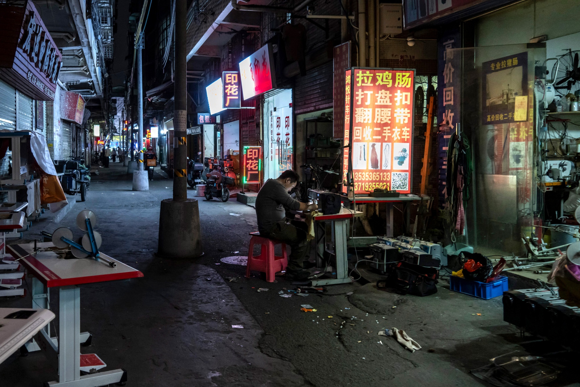 Evening activities in Datang, an urban village in the middle of the city and home to countless small low end garment workshops in Guangzhou, China on Friday 27 February, 2026 