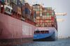 Container ships sit docked at the Port of Oakland in Oakland, California.