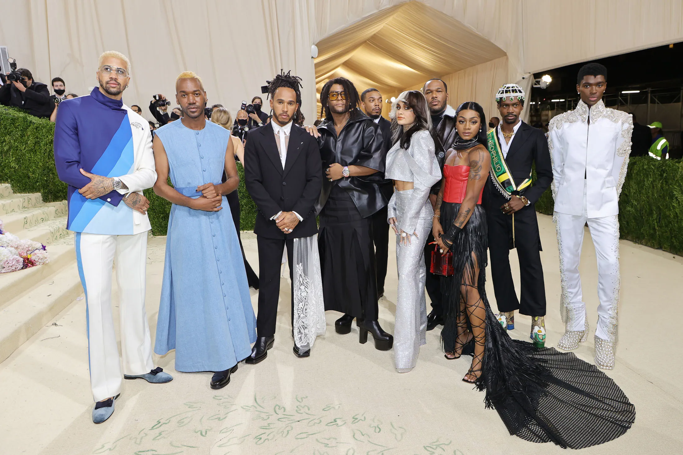 At the Met Gala (from left): Olympic fencer Miles Chamley-Watson, designer Kenneth Nicholson, race car driver Lewis Hamilton, stylist&nbsp;Law Roach, singer Kehlani, designer Jason Rembert, track star Sha’Carri Richardson, designer Edvin Thompson, and model Alton Mason.