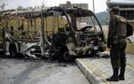 A Metro bus burned by gang members in Medellin in April.