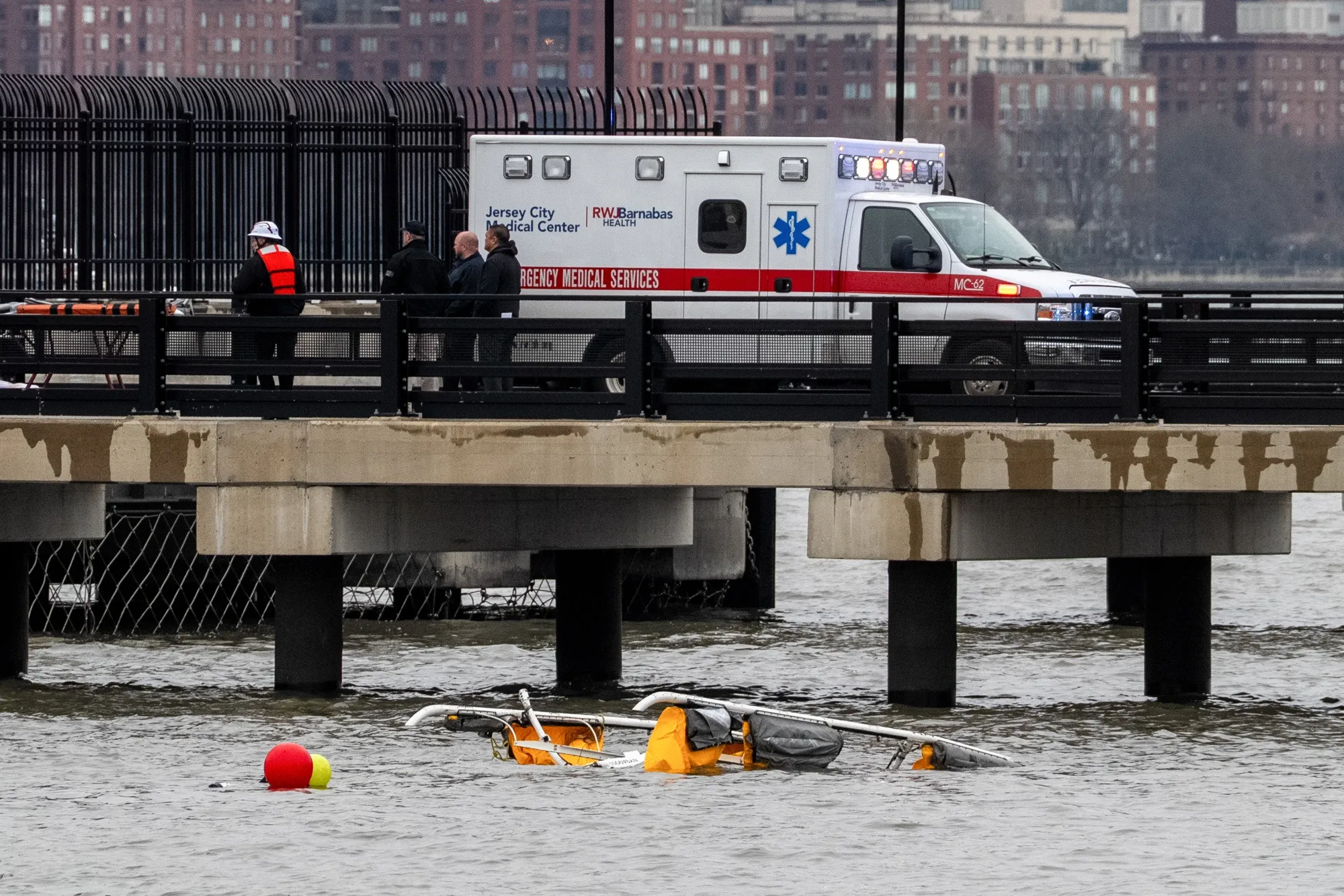 Debris floats in the water at the scene where the helicopter crashed in the Hudson River in Jersey City, New Jersey, on April 10.