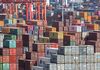 Containers sit stacked at the Yangshan Deep Water Port in Shanghai, China, on Tuesday, July 10, 2018. China told companies to boost imports of goods from soybeans to seafood and automobiles from countries other than the U.S. after trade tensions between the world's two biggest economies escalated into a tariff war last week.