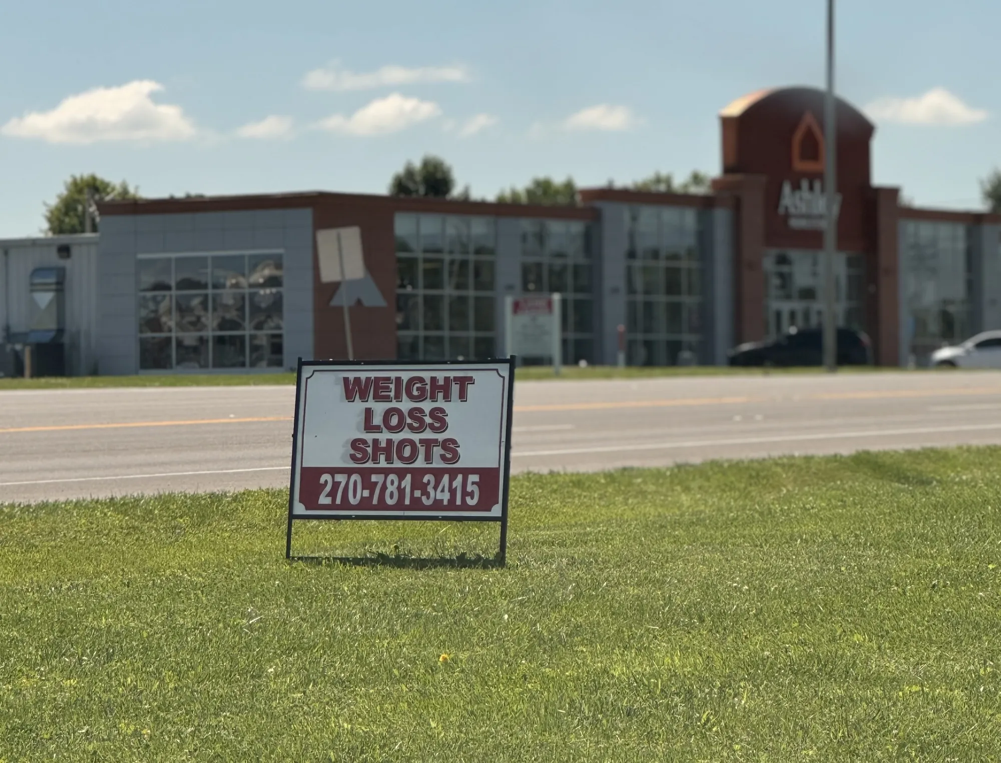 A sign for weight-loss shots outside of a local gynecologist's office.