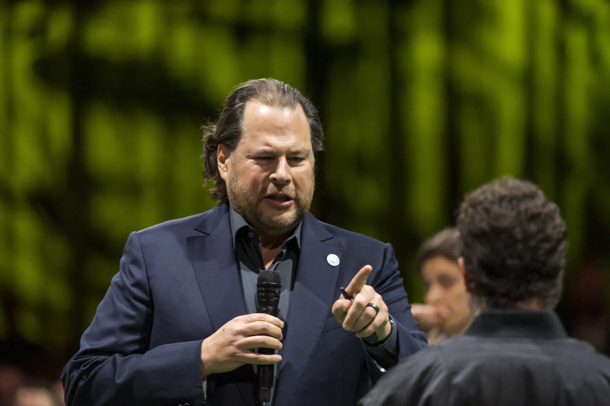 Marc Benioff speaks to a protester during the opening keynote of the 2019 DreamForce conference on Nov. 19.