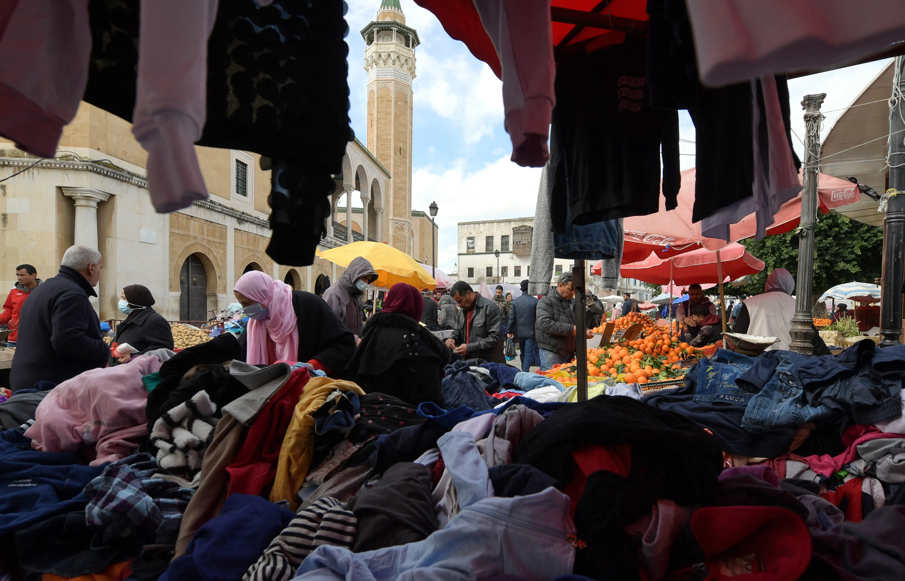 Tunisians shop at a market near Tunis.