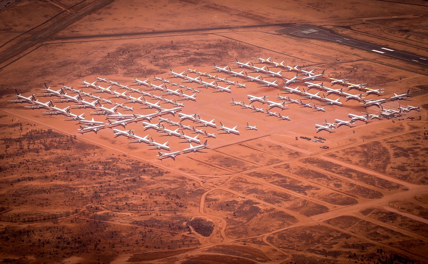 Planes are parked at a storage facility located at Alice Springs Airport