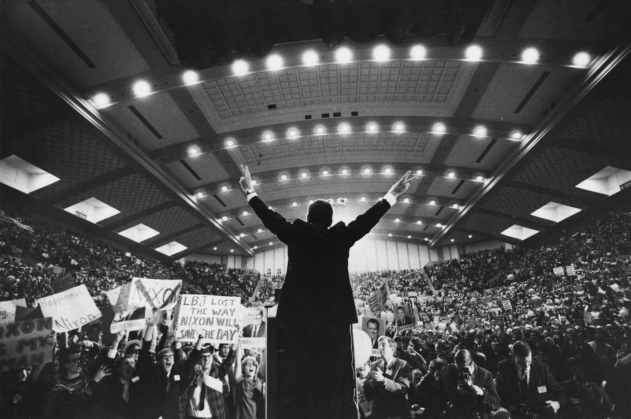 Richard Nixon flashes the victory sign in 1968.
