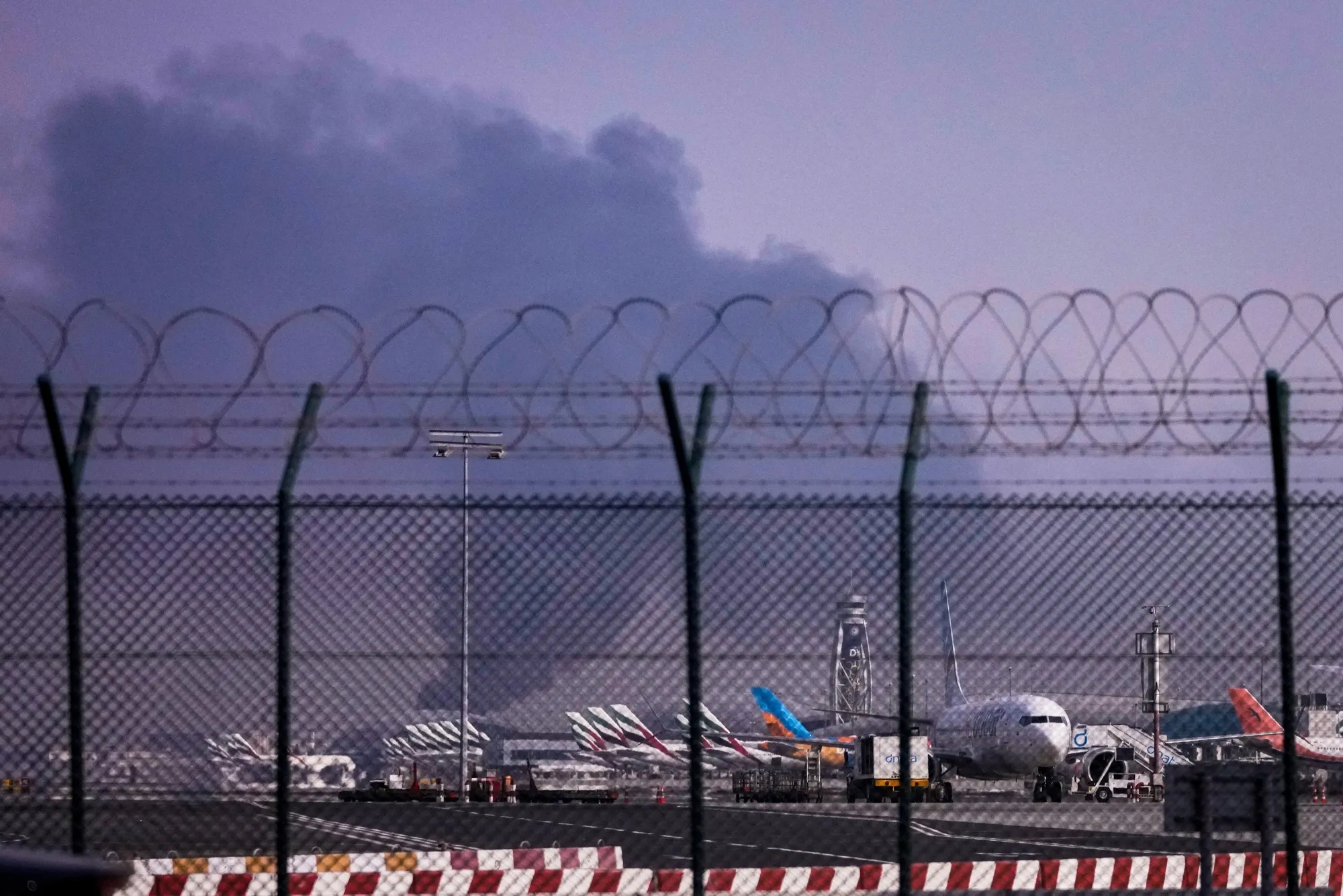 Smoke beyond Dubai International Airport following a drone strike, on March 16.