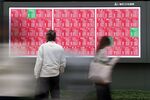 A screen displays rising share prices outside a securities firm in Tokyo, Japan, on Monday, Oct. 27, 2025. The blue-chip Nikkei 225 Stock Average surpassed the psychologically key level of 50,000 for the first time as investor sentiment was boosted by growth optimism under Japan’s new prime minister and easing US-China frictions.