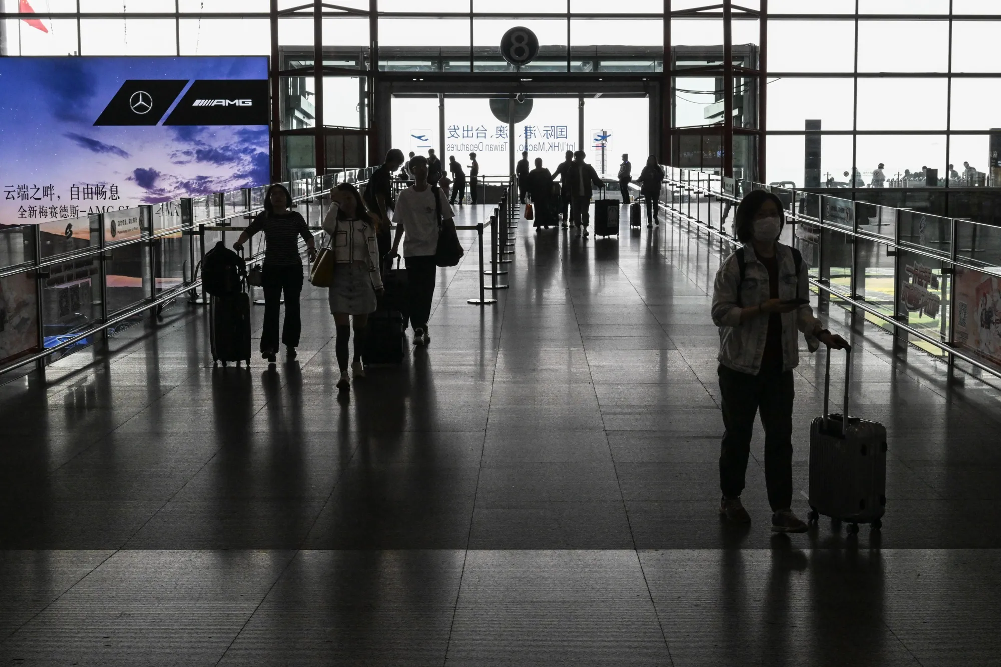 Travelers at Beijing Capital International Airport.