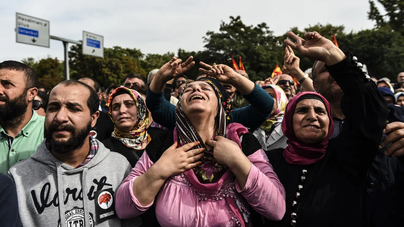People express their grief as they gather in Ankara on Sunday, Oct. 11, 2015, a day after the city was struck by deadly twin bomb attacks. Thousands of people took to the streets of Ankara to denounce the government and remember the 95 people killed in twin suspected suicide bombings on a peace rally, as Turkey mourned its worst ever attack.
