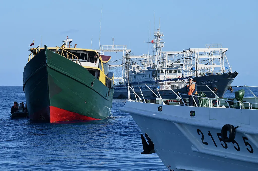 Philippine Coast Guard and Chinese maritime vessels in the South China sea.