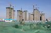 Buildings stand under construction in Shijingshan District in Beijing, China, on Thursday, Jan. 17, 2019. China is facing its most difficult economic environment in years. The world's second-biggest economy is in a trade standoff with the biggest -- the U.S. -- and under pressure from President Xi Jinping's "critical battles" to reduce China's massive debt pile and clean up toxic air pollution.