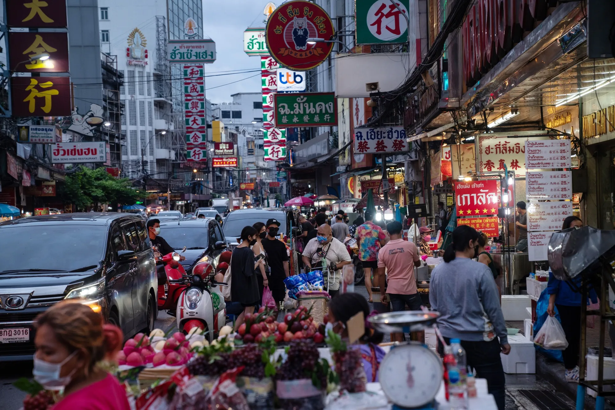 Shoppers and pedestrians on Yaowarat Road in the Chinatown area of Bangkok.