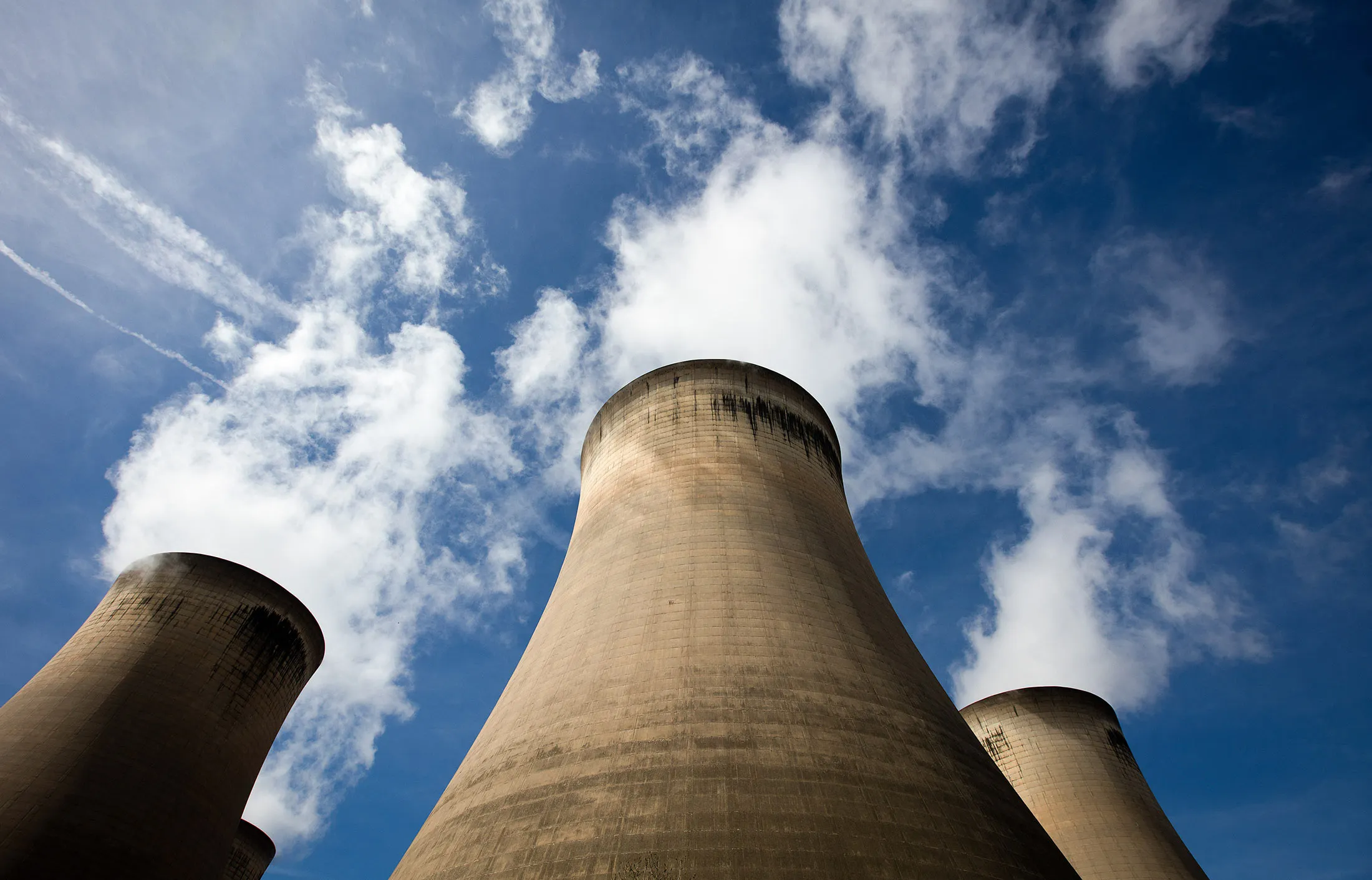 Cooling towers stand within the Drax Group Plc.'s power station complex near Selby, U.K., on Wednesday, May 4, 2016.
