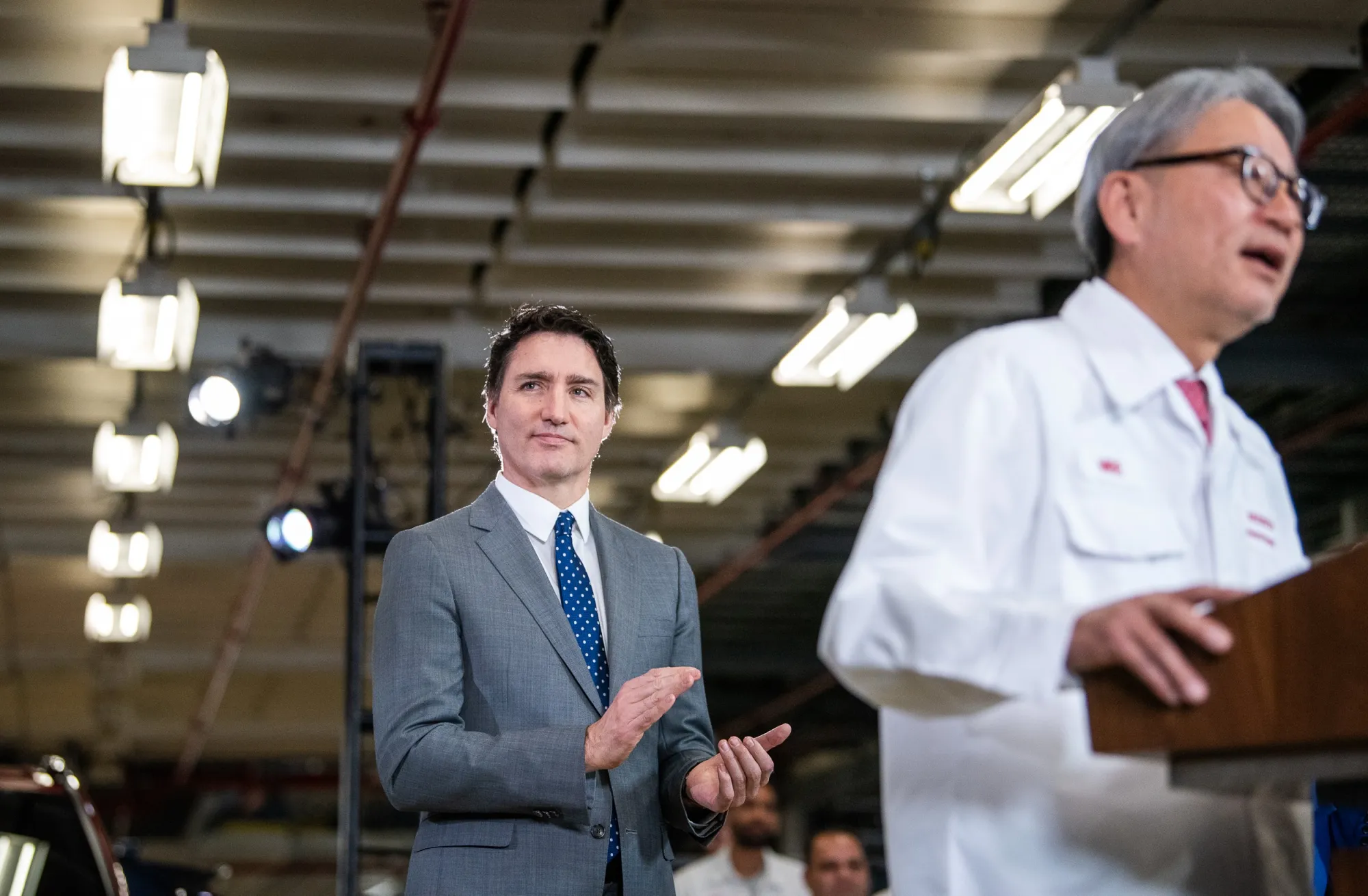 Justin Trudeau, Canada’s prime minister at the time, looks on as Honda CEO Toshihiro Mibe announces a huge investment in electric vehicles in Canada in 2024. That investment is now on hold.