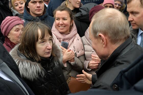 In His Hometown, Putin Gets Surprise Grilling...And Gives Gifts