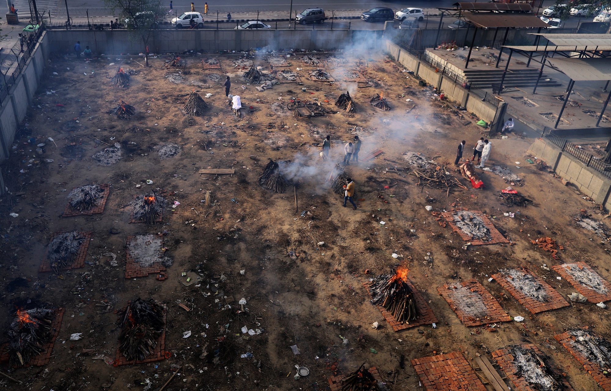 Funeral pyres burn at a sit of mass cremations in New Delhi, India, on April 21.