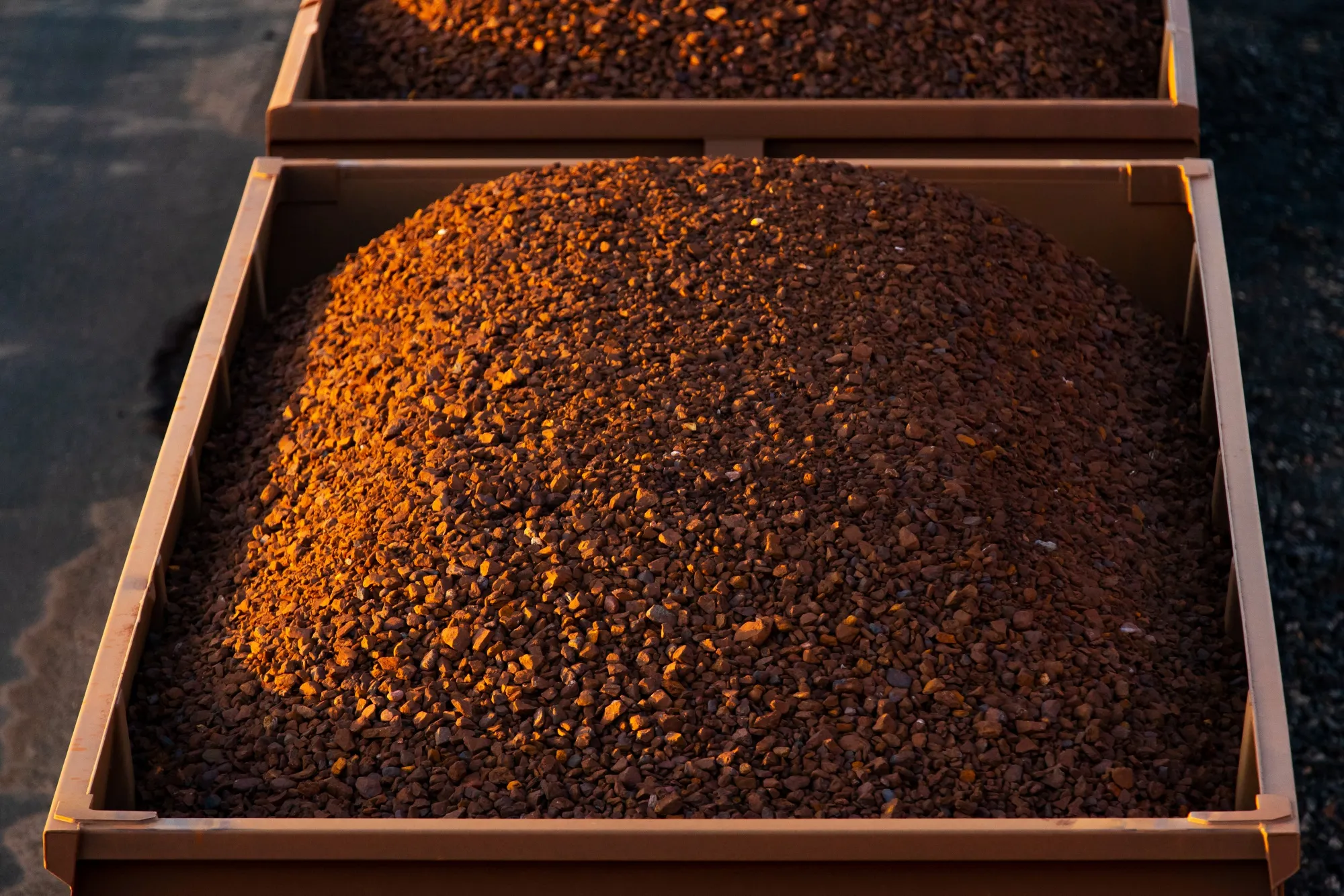 Wagons Of Iron Ore Make Their Way To Port By Rail And Road