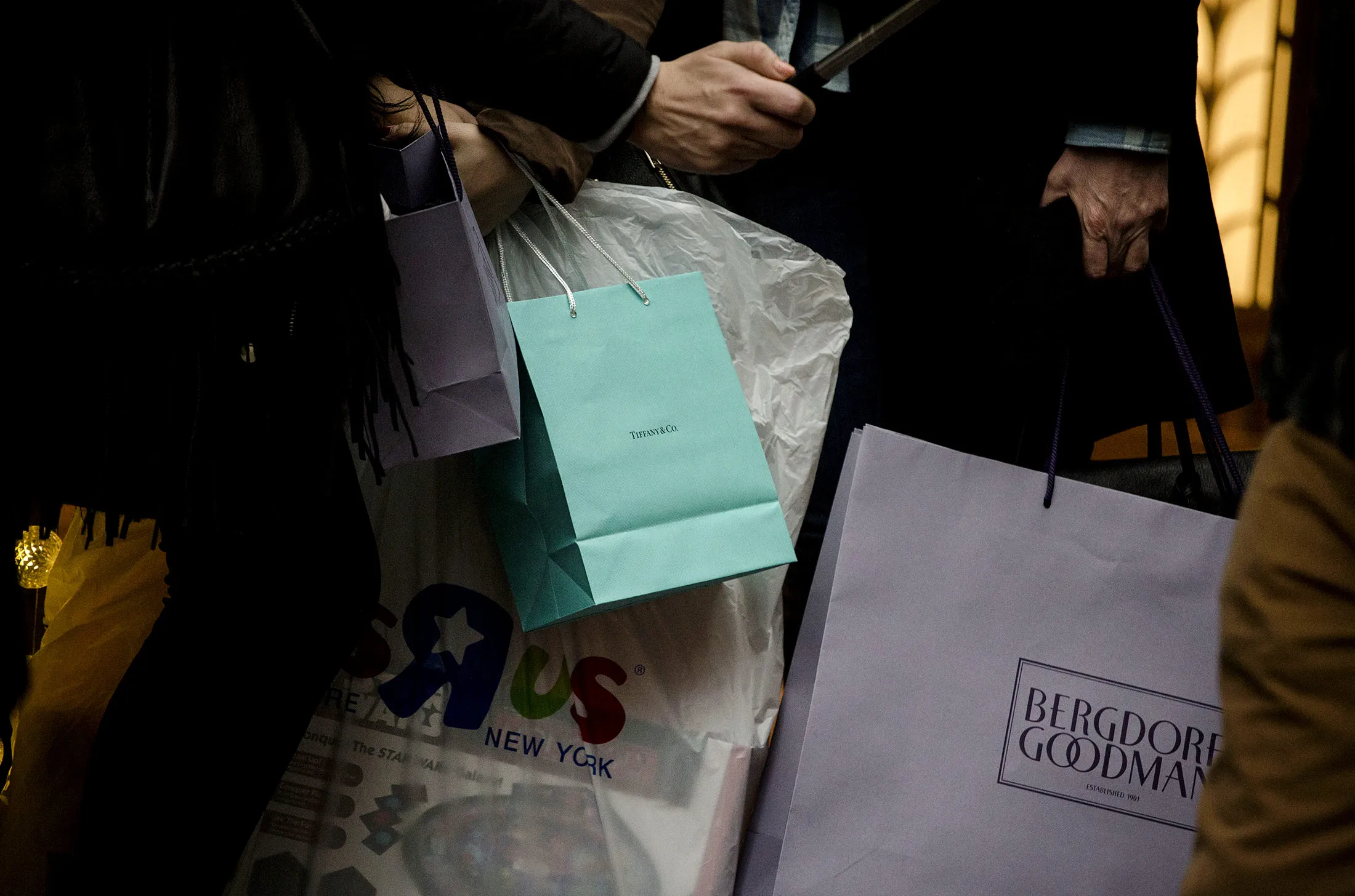 A pedestrian holds a Tiffany &amp; Co. shopping bag in New York, U.S., on Sunday, Nov. 22, 2015. Tiffany &amp; Co. is scheduled to report earnings figures on November 24.
