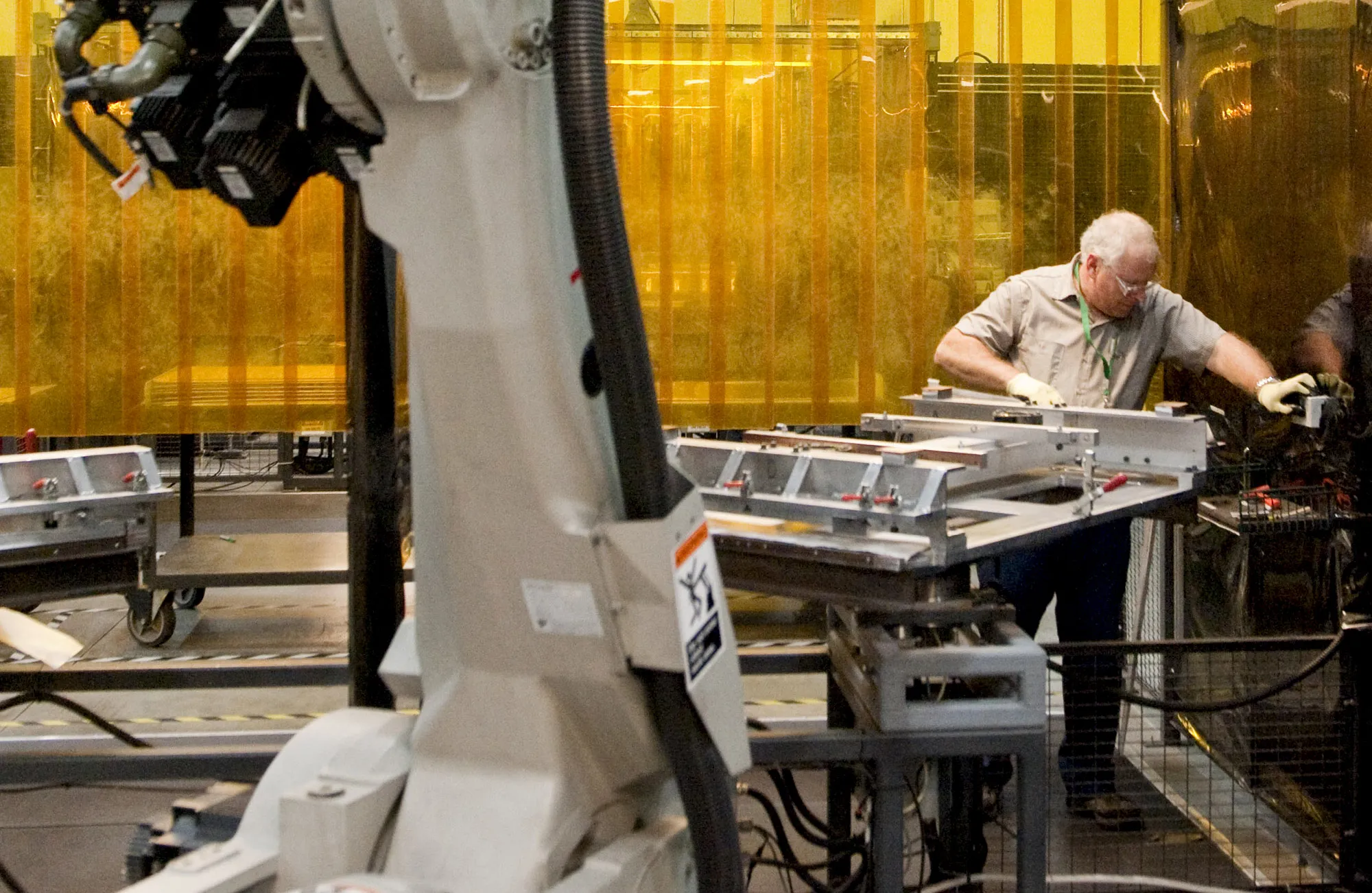 A worker prepares a bipolar plate for a fuel cell inside the FuelCell Energy manufacturing facility in Torrington, Connecticut.