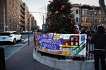 A People's Court puts Target "on trial" just beyond a Queens Neighborhoods United sign on January 6, 2019, in Jackson Heights, Queens.