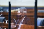 A reflection of Jerome Powell during a House Financial Services Committee hearing on Dec. 2.