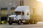 A truck drives outside a warehouse in Redlands, California.
