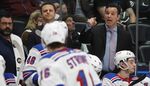 New York Rangers head coach David Quinn, right, gestures in the second period of an NHL hockey game Wednesday, March 11, 2020, in Denver. More than three decades since he was supposed to play for the U.S. at the 1988 Games in Calgary, Quinn is getting a second Olympic opportunity as the Americans' coach in Beijing. It's also a chance for Quinn to get back into coaching in the NHL after being fired last summer by the New York Rangers following three seasons dedicated to a rebuild. (AP Photo/David Zalubowski, File)