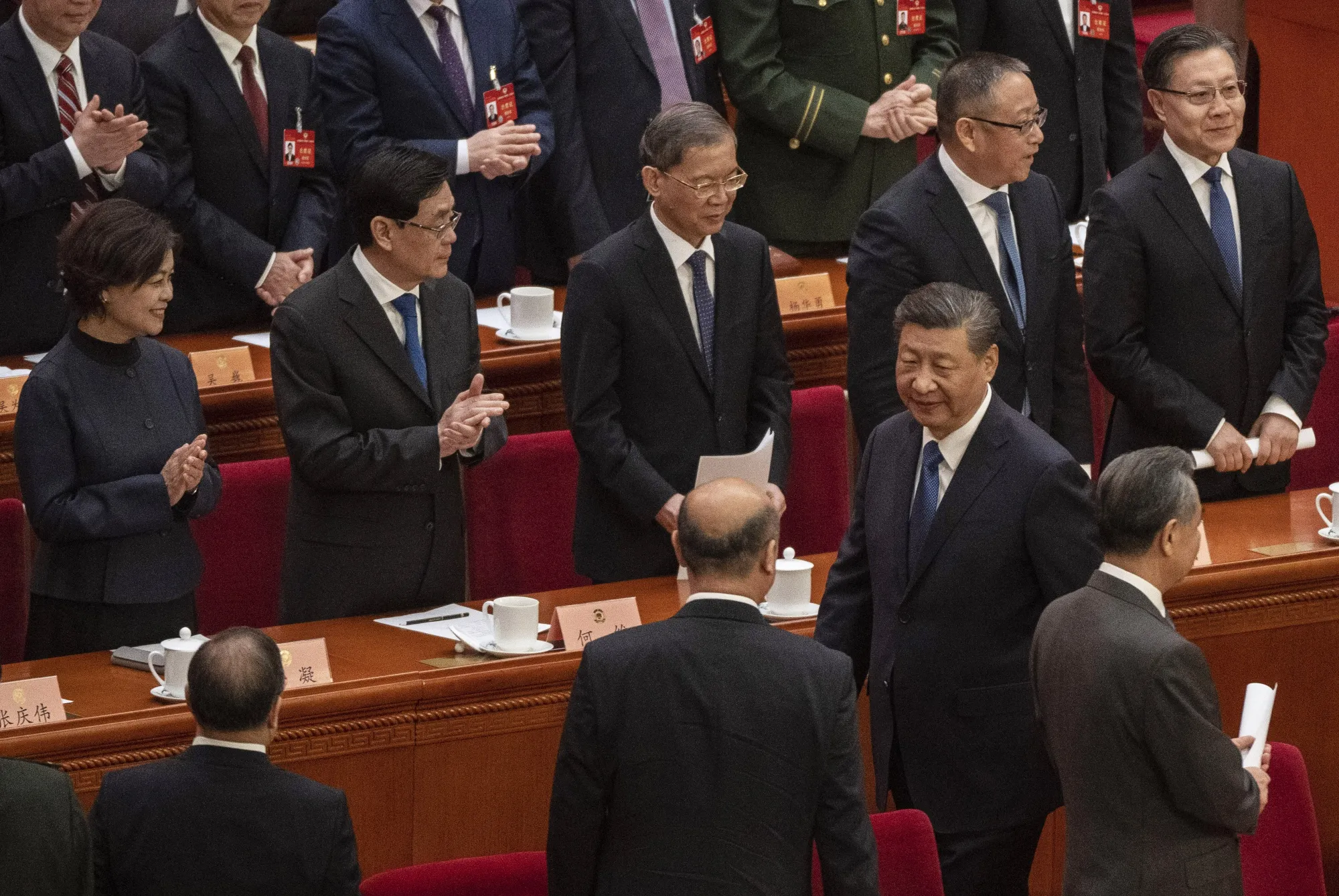 Xi Jinping is applauded by delegates at the closing session of the Chinese People's Political Consultative Conference on March 10.