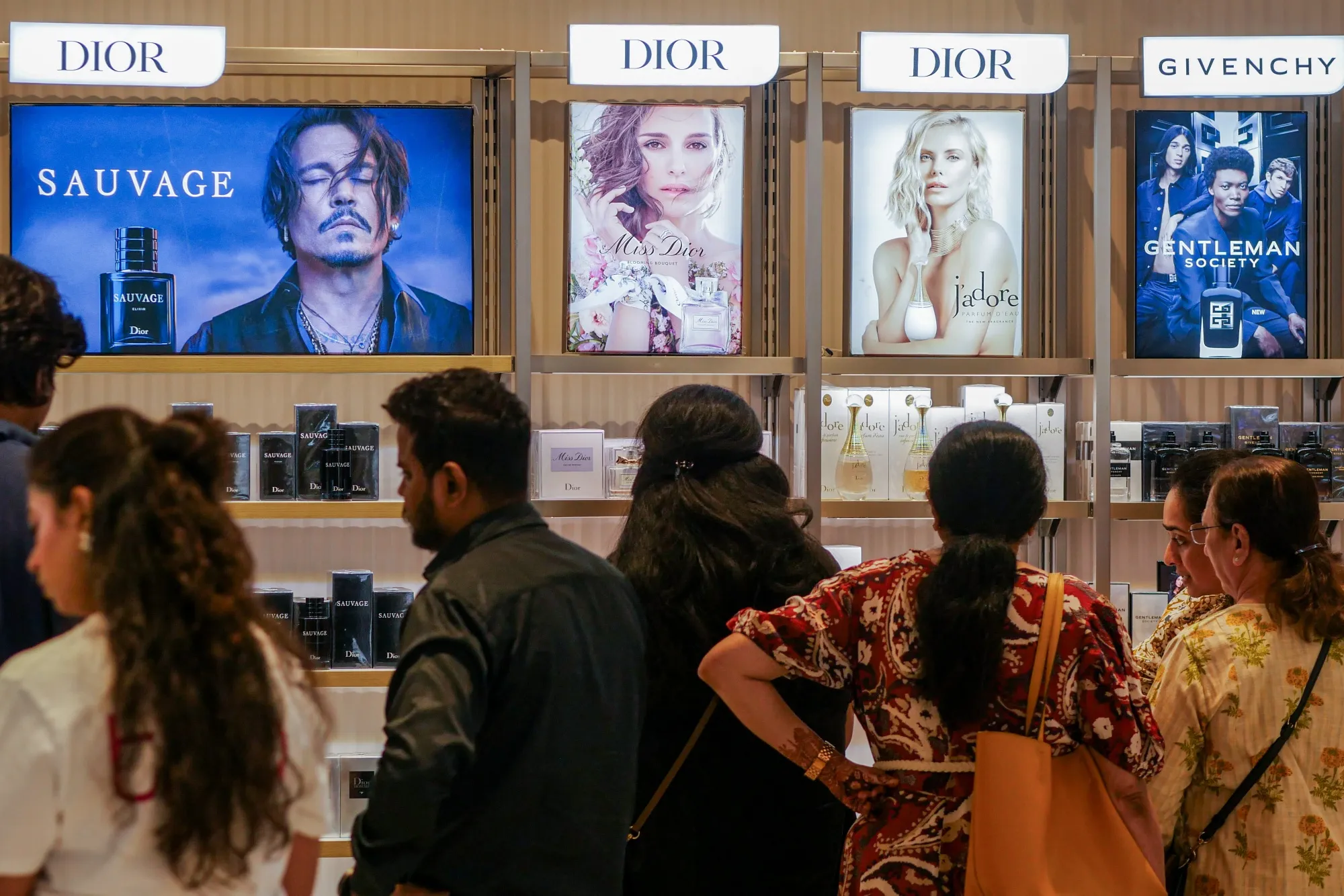 Customers browse perfumes at a Tira store in Mumbai.