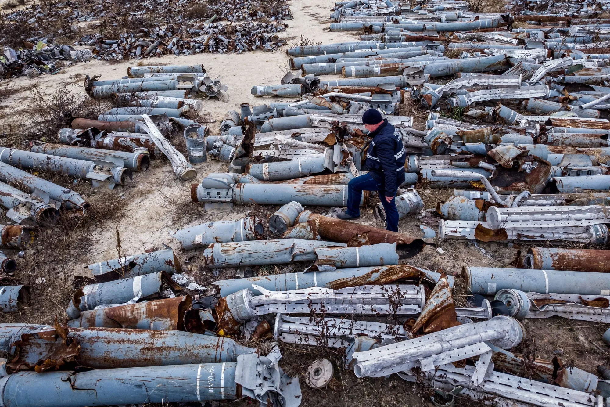 A person&nbsp;examines&nbsp;collected remnants of shells and missiles used by the Russian army on December 7 in Kharkiv.&nbsp;