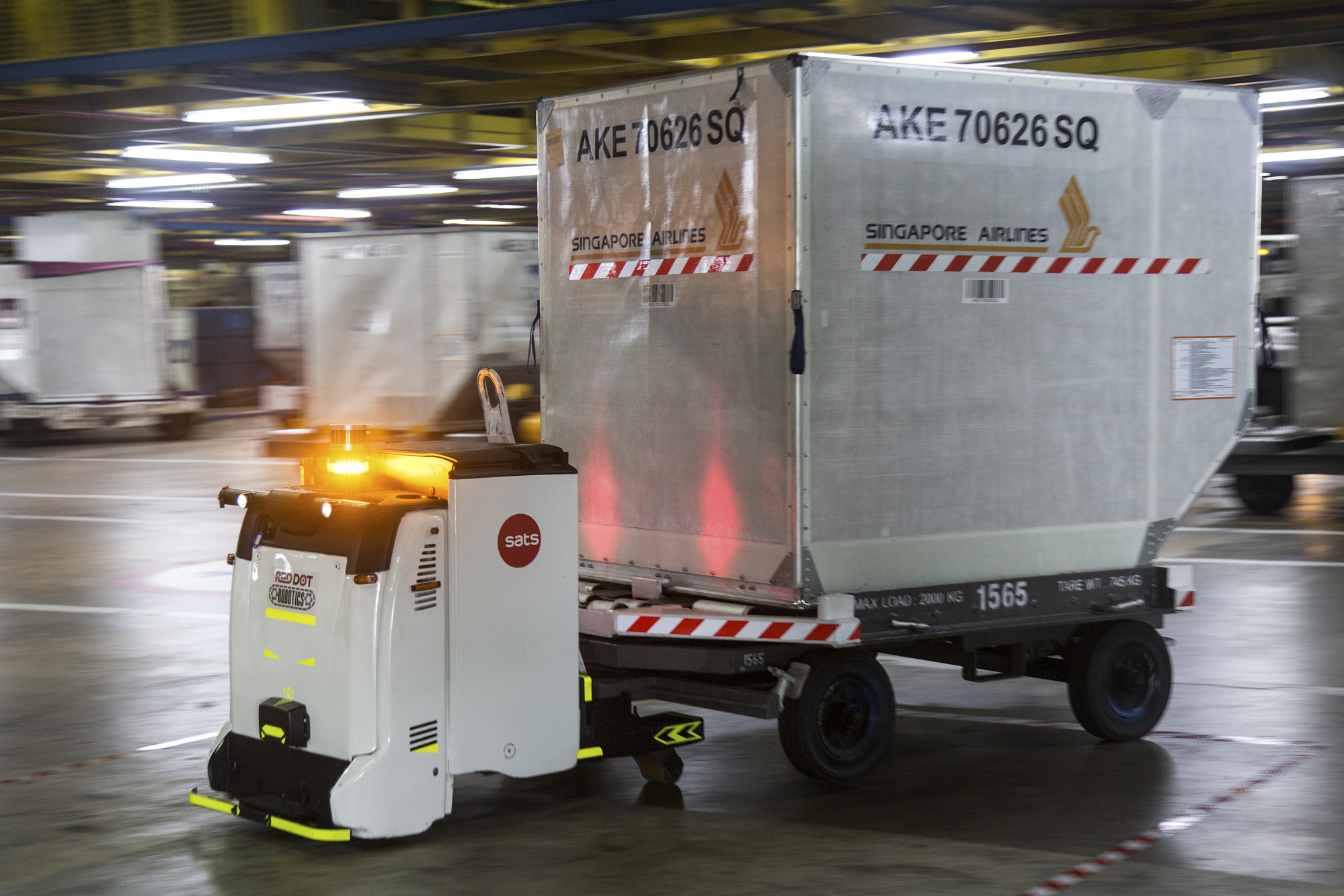 An Autonomous Container Trailer transports a cargo container at Changi International Airport in Singapore.