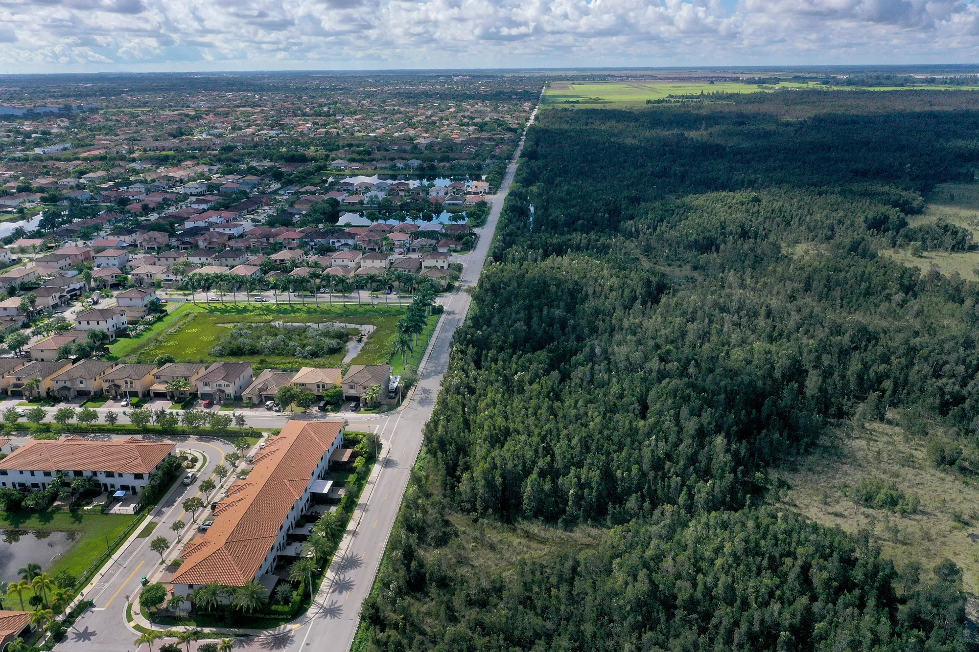 Urban sprawl next to protected wetlands on the fringes of Everglades National Park in Miami Dade County, Florida, in 2021.