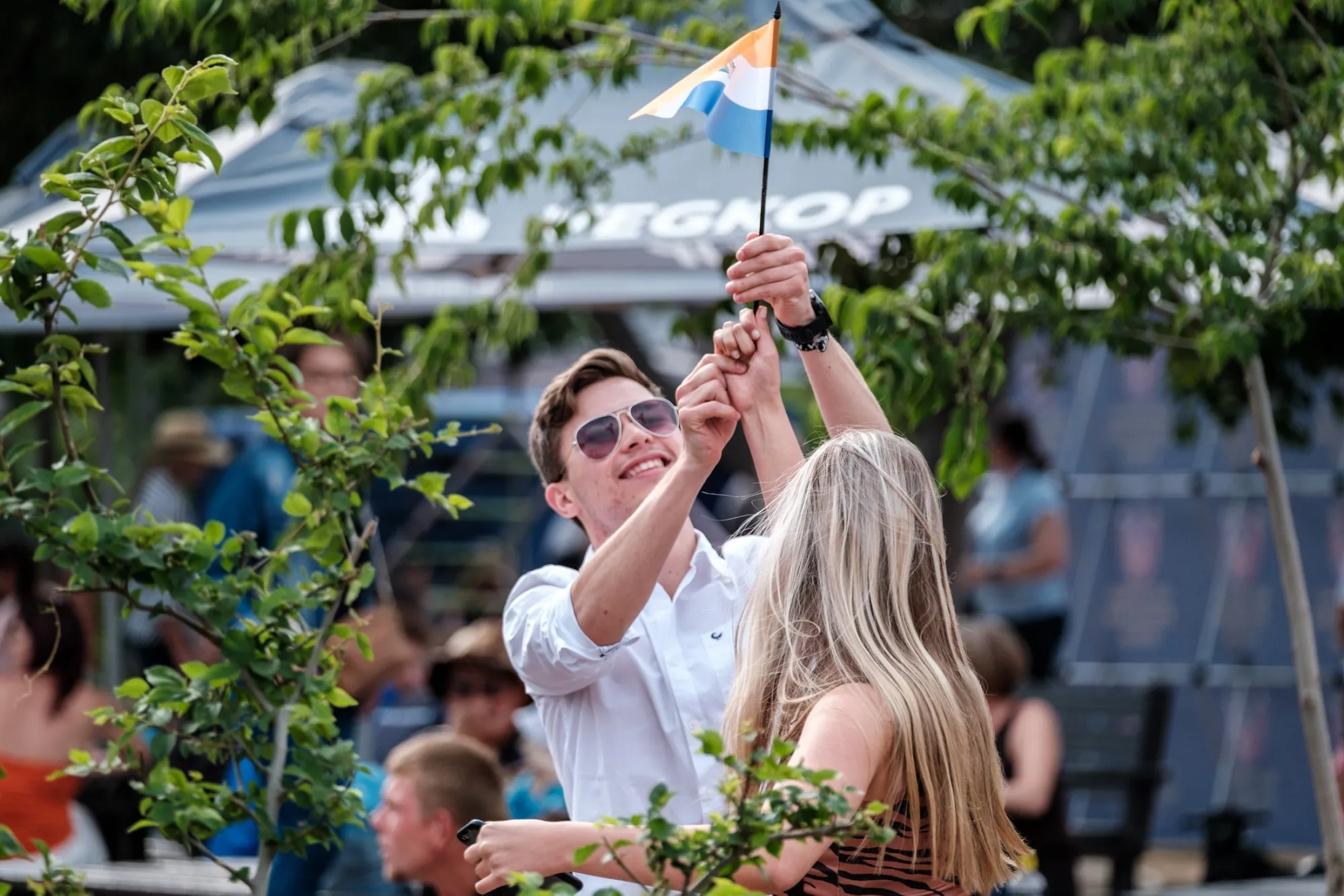 A couple wave&nbsp;the old South African flag at an event at the Voortrekker Monument in Pretoria.
