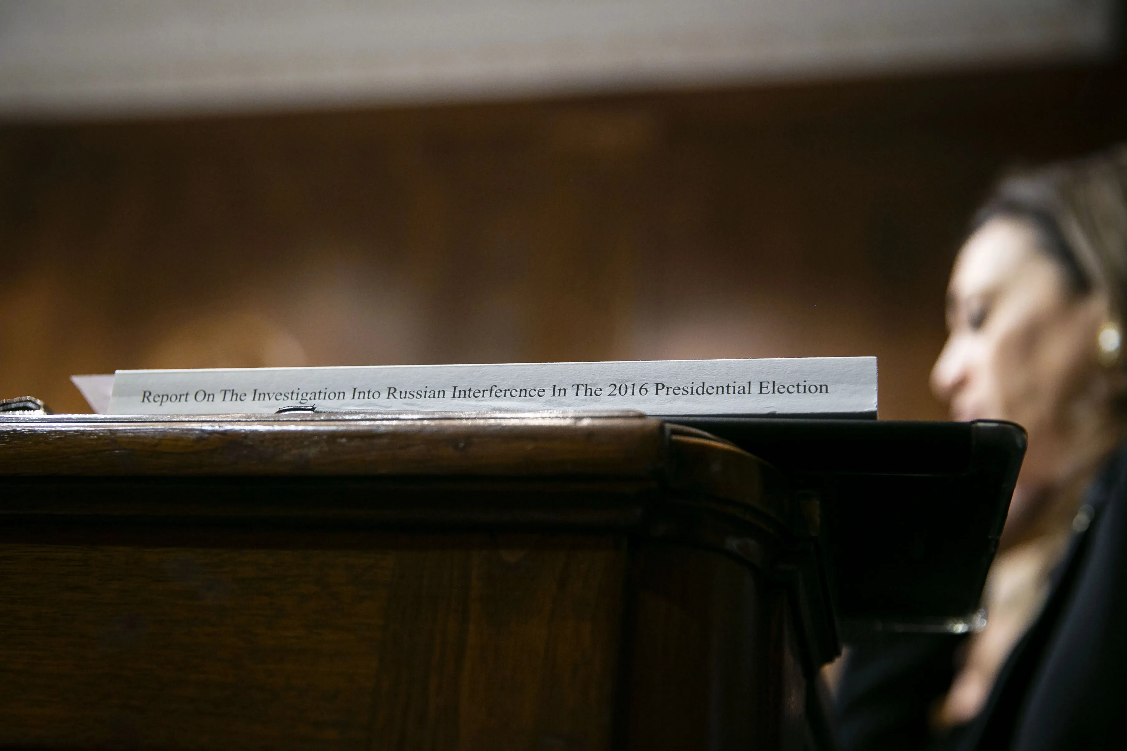 A copy of the report&nbsp;sits on a desk during William Barr’s Senate Judiciary Committee hearing.