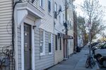 The three-unit rental, left, that landlord Joaquin Villanueva owns in Boston.