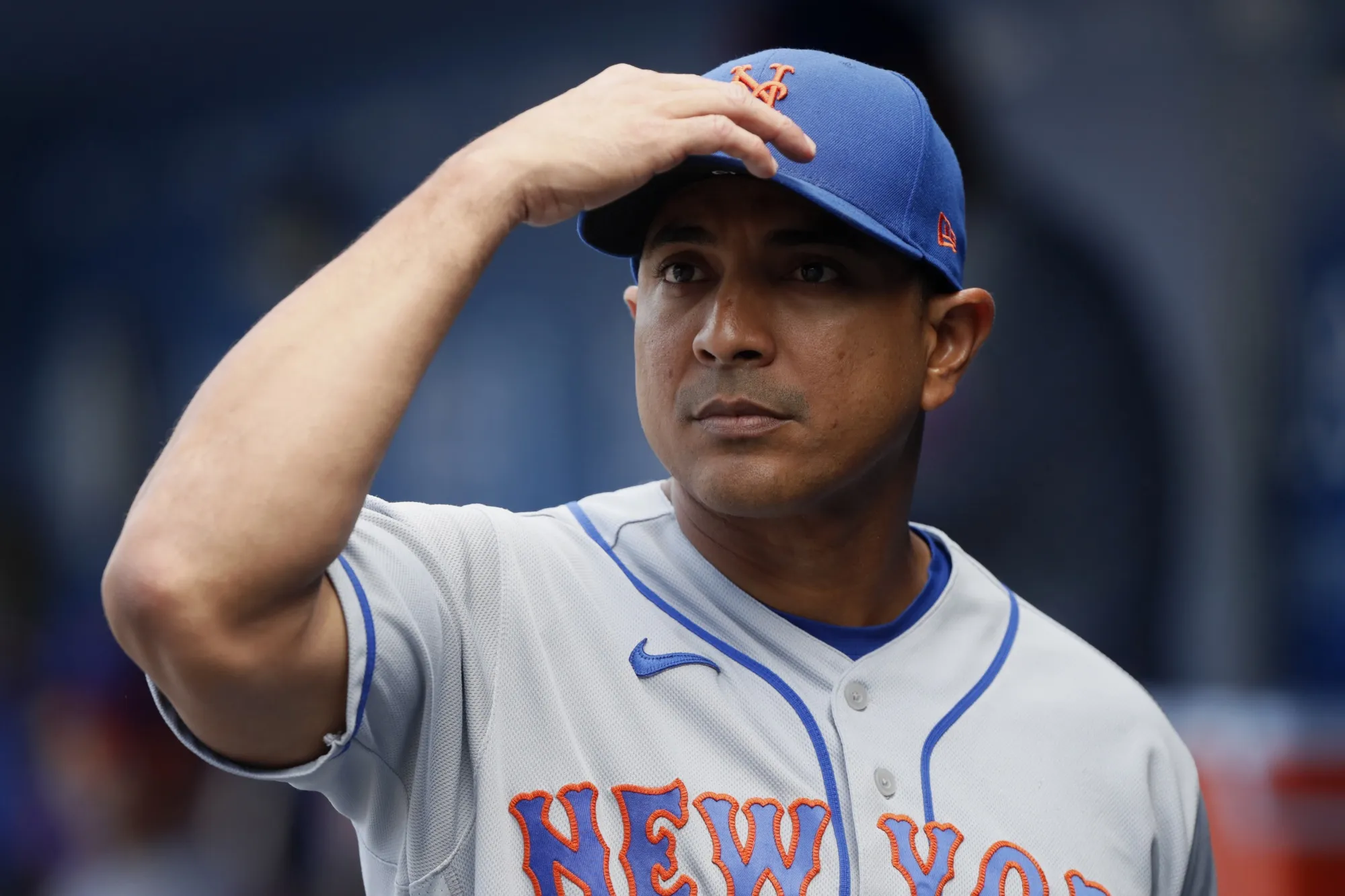 New York Mets manager Luis Rojas looks over before a baseball game against the Los Angeles Dodgers in Los Angeles, Sunday, Aug. 22, 2021. On Monday, Nov. 15, 2021, the New York Yankees hired former Mets manager Rojas as their third base coach, a month after he lost his job with the crosstown rivals. (AP Photo/Alex Gallardo, File)