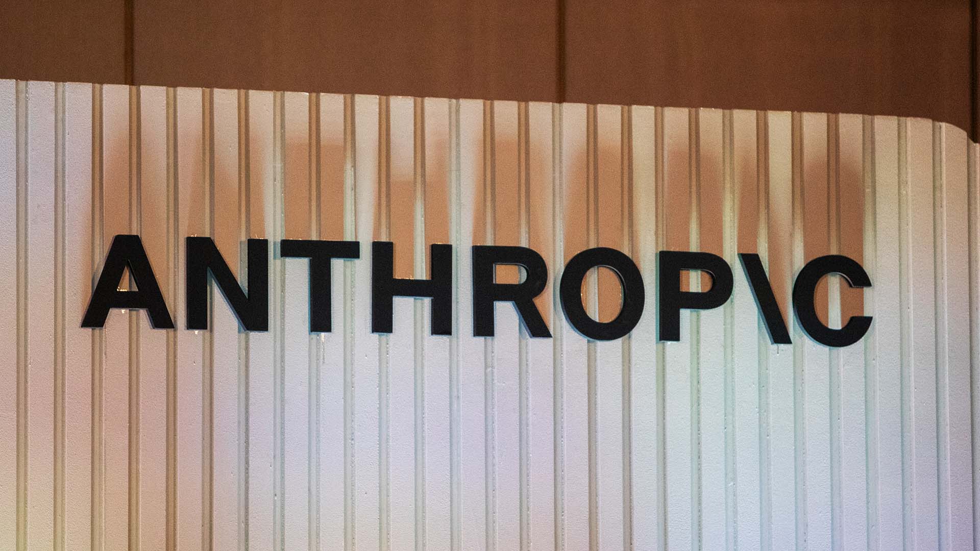 Anthropic office sign mounted on a ribbed wall