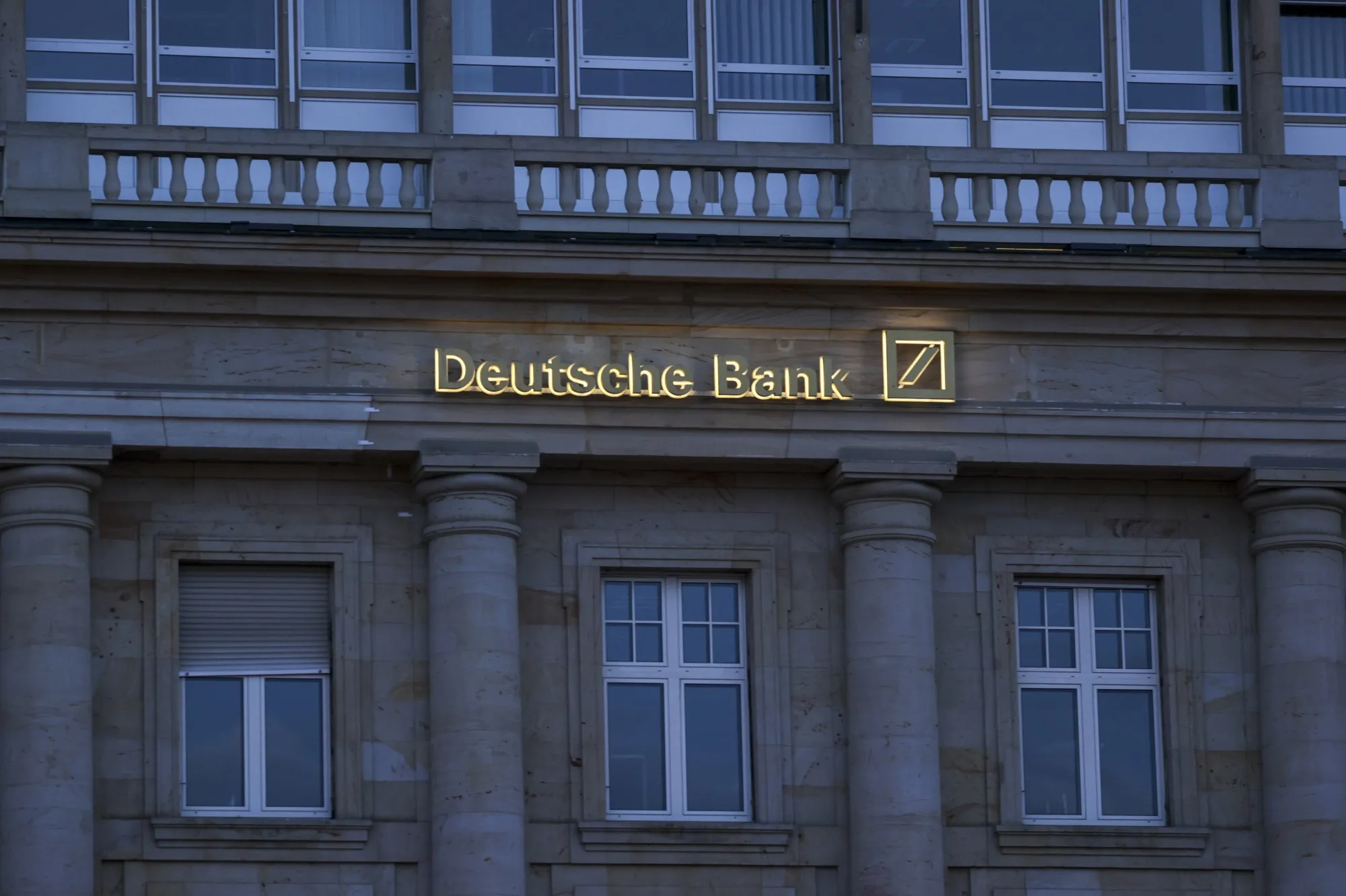 Signage for Deutsche Bank AG at a branch in the financial district of Frankfurt, Germany, on Friday, May 6, 2022. European banks are counting the rising costs of Russia’s invasion of Ukraine as the war pushes up commodity prices and disrupts corporate supply chains.