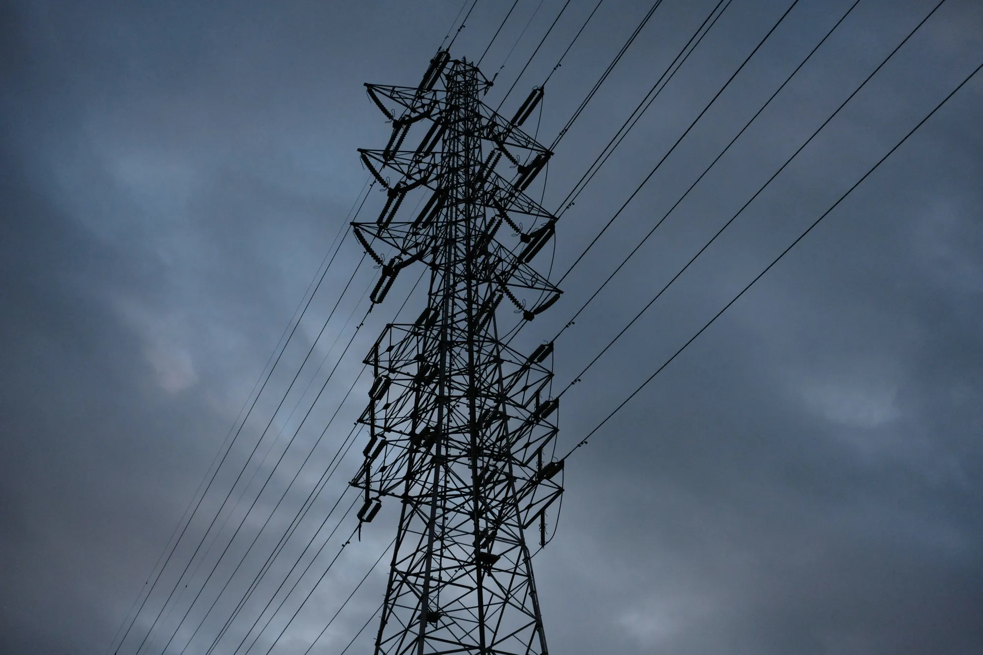 Power lines hang from a transmission pylon in Yokohama.